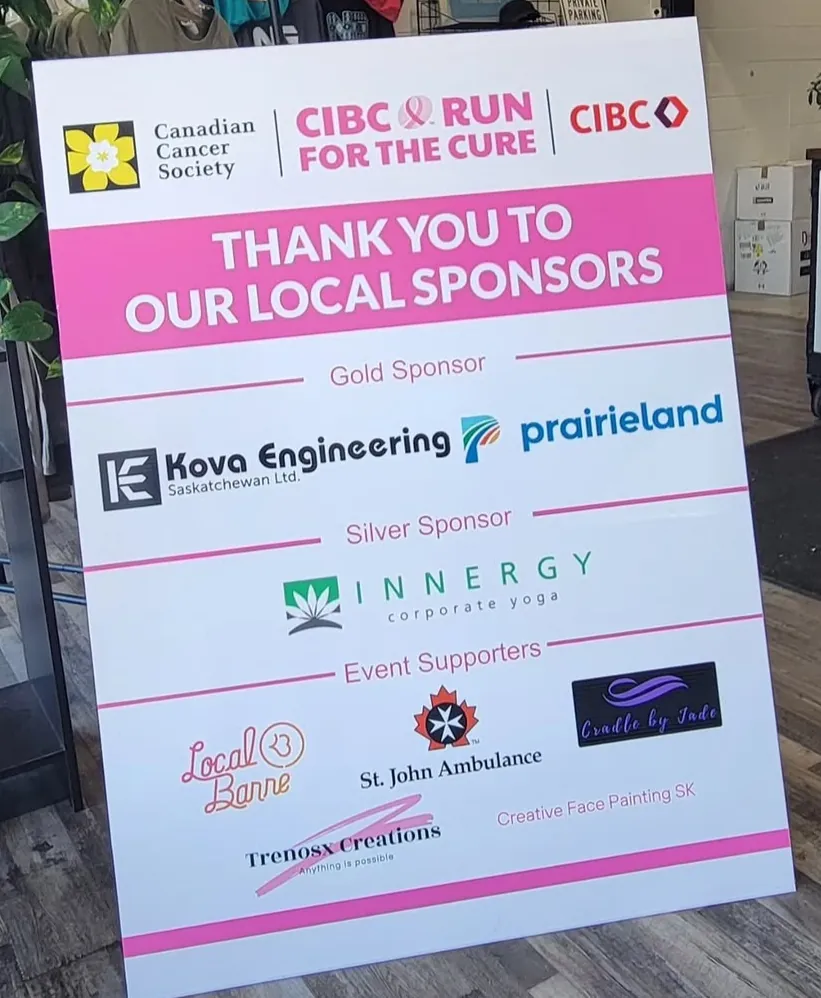 CIBC Run for the Cure sign thanking local sponsors, with Canadian Cancer Society and CIBC logos and gold, silver, and event supporter sections