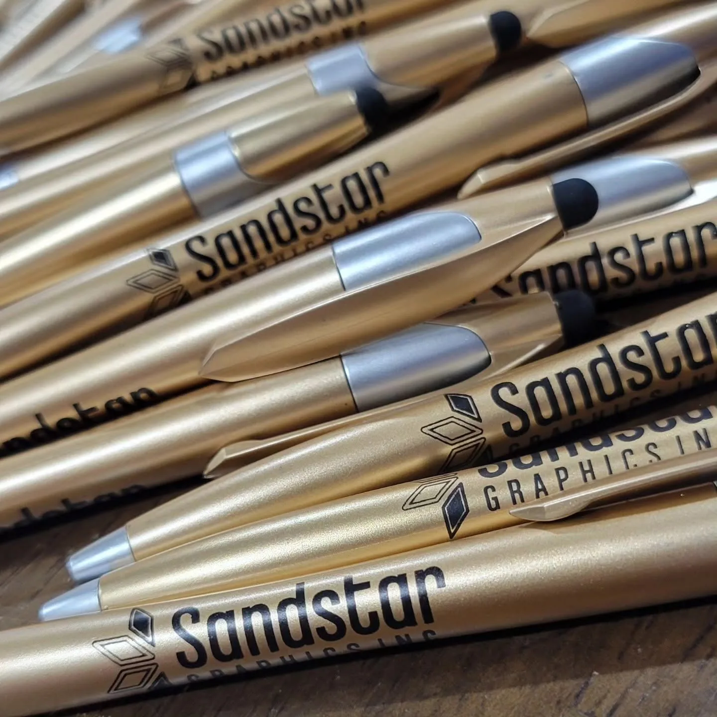 Custom branded pens with the Sandstar Graphics logo, promotional products from Sandstar Graphics in Saskatoon
